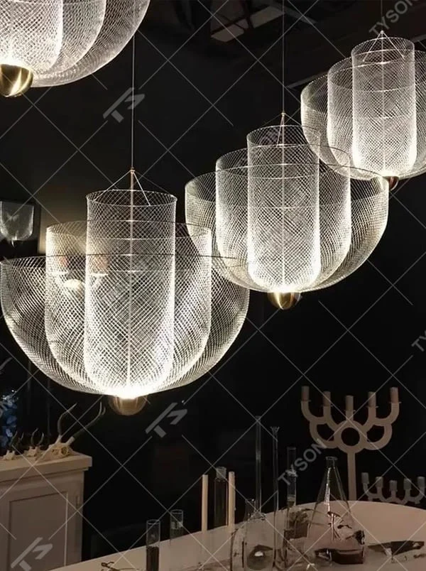 This is a modern artistic metal mesh chandelier, with multi-layer mesh structure, transparent texture and golden base, featuring strong artistic sense and modern style. It is used for space lighting and decoration, creating an artistic and modern atmosphere. It is suitable for modern art home living rooms, designer studios, art exhibition halls and other places.