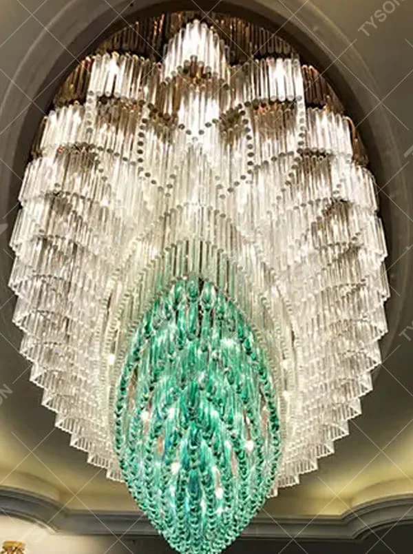 This is an artistic turquoise glass chandelier, with multi-layer turquoise glass components in an irregular hanging shape, transparent and brilliant texture, featuring extremely artistic and luxurious design. It is used for space lighting and decoration, creating a high-end artistic luxury atmosphere. It is suitable for high-end hotel lobbies, luxury banquet halls, art exhibition halls and other places.