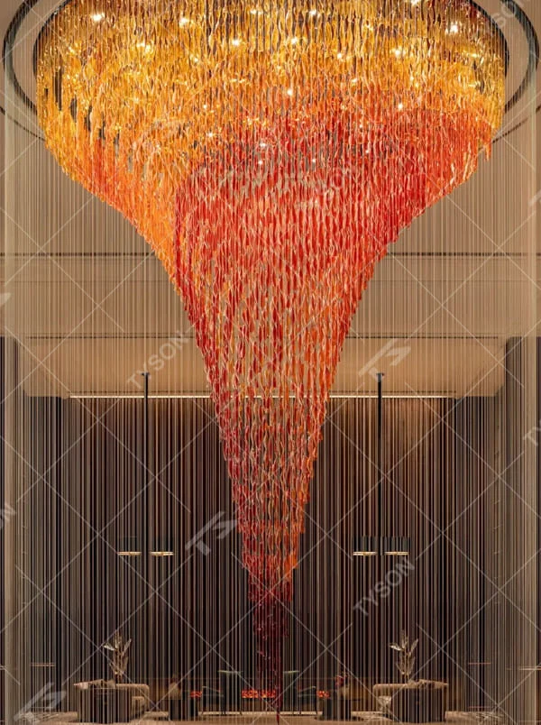 This is a luxurious gradient crystal waterfall-style large chandelier, composed of crystal strings gradient from gold to red in an inverted funnel shape, with a shocking and artistic design. It is used for space lighting and artistic decoration, creating a luxurious and shocking visual atmosphere. It is suitable for high-end hotel lobbies, luxury clubs, atriums of large commercial complexes and other places.