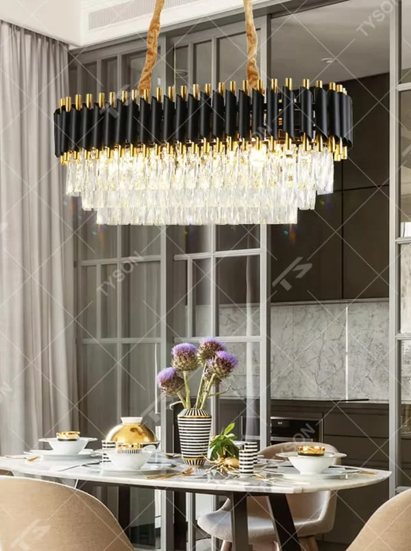 This is a luxury black-gold crystal chandelier, with black-gold metal columns and multi-layer transparent crystals, featuring a modern luxury design with brilliant and grand lighting. It is used for space lighting and decoration, creating a high-end luxury atmosphere. It is suitable for luxury-style home living rooms, high-end restaurants, luxury clubs and other places.