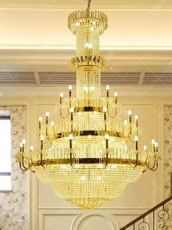 This is a European luxury golden crystal chandelier, with a golden metal frame, multi-layer transparent crystal pendants, and multi-arm design, featuring brilliant lighting, strong luxury sense and visual impact. It is used for space lighting and decoration, creating a high-end luxury atmosphere. It is suitable for luxury villa living rooms, high-end hotel lobbies, banquet halls and other places.
