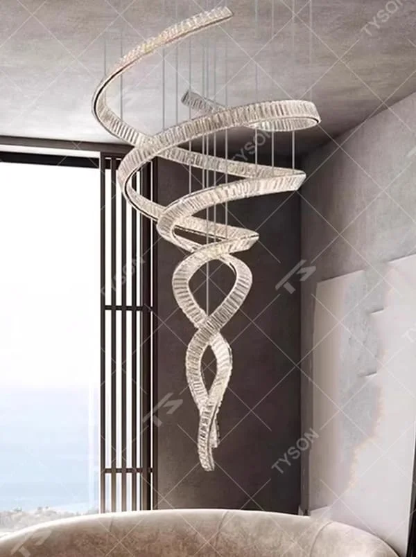 This is a luxury spiral crystal chandelier with winding crystal light strips, featuring a modern and artistic design with high-end luxury ambiance. It is used for space lighting and decoration, creating a stunning visual focus and opulent atmosphere. It is suitable for villa double-height living rooms, high-end hotel lobbies, art exhibition halls and other places.