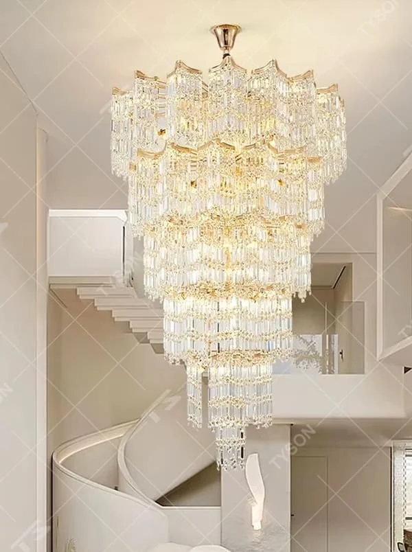 This is a luxury multi-layer conical crystal chandelier, with a golden metal frame and numerous transparent crystal pendants, featuring a magnificent and grand design with brilliant lighting and strong visual impact. It is used for space lighting and decoration, creating a high-end luxury atmosphere. It is suitable for duplex stairwells, high-ceilinged living rooms, high-end hotel lobbies, luxury villas and other places.