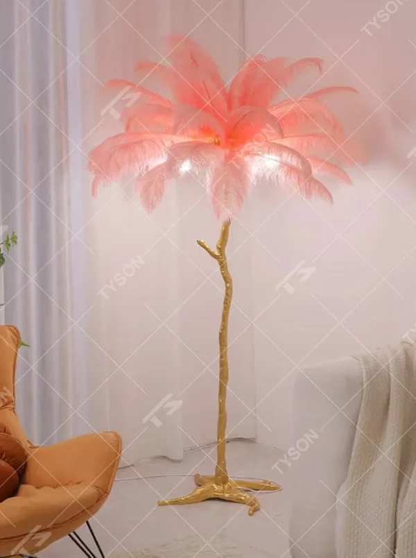 This is a light luxury artistic feather-shaped floor lamp, with a golden branch-shaped metal bracket and numerous pink ostrich feathers. It features a romantic and luxurious design, with warm and soft lighting. It is used for space ambient lighting and decoration, creating a romantic artistic atmosphere. Suitable for light luxury-style bedrooms, internet-famous check-in shops, art homestays and other places.