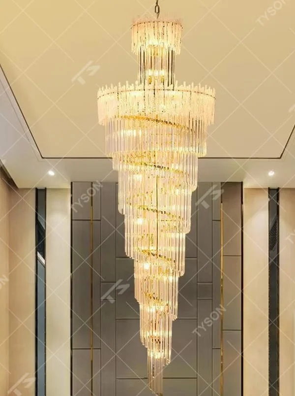 This is a modern luxurious large spiral crystal chandelier, with a golden metal frame paired with transparent crystal strips arranged in multiple spirals. It features a strong sense of spatial depth and artistry, with brilliant and grand lighting. It is used for space lighting and artistic decoration, creating a luxurious and high-end atmosphere. Suitable for high-ceiling lobbies of high-end hotels, double-height living rooms in luxury villas, large commercial clubs and other places.