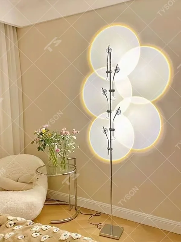 This is a modern artistic multi-circular light and shadow floor lamp, with a metal branch-like structure and multiple circular light-emitting panels. The light projects circular light and shadow with yellow edges, featuring a strong sense of modern art and light-shadow hierarchy. It is used for space lighting and decoration, creating a warm and artistic atmosphere. Suitable for modern bedrooms, artistic living rooms, designer studios and other places.