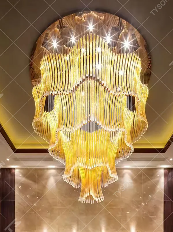This is a luxurious artistic multi-layer yellow glass tube chandelier, composed of numerous yellow glass tubes arranged in layers to form a flowing three-dimensional shape. It features brilliant and layered lighting, with a strong sense of artistic tension and luxury. It is used for space lighting and artistic decoration, creating a luxurious artistic and grand atmosphere. Suitable for high-end hotel lobbies, luxury banquet halls, art clubs and other places.