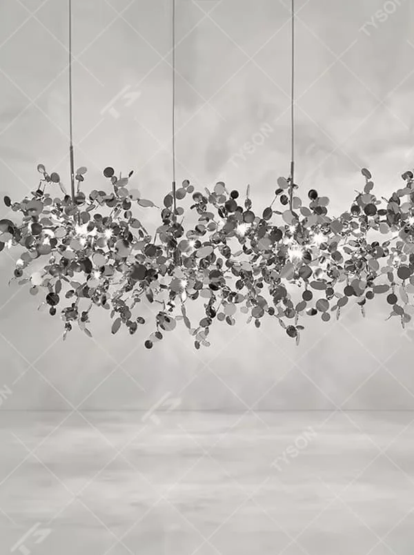 This is an artistic installation-style metal disc chandelier, with numerous metal discs interwoven in a scattered manner, featuring strong artistic sense and modern style, and the light reflects a brilliant visual effect. It is used for space lighting and artistic decoration, creating an artistic and modern atmosphere. It is suitable for art exhibition halls, high-end hotel lobbies, modern art home living rooms and other places.