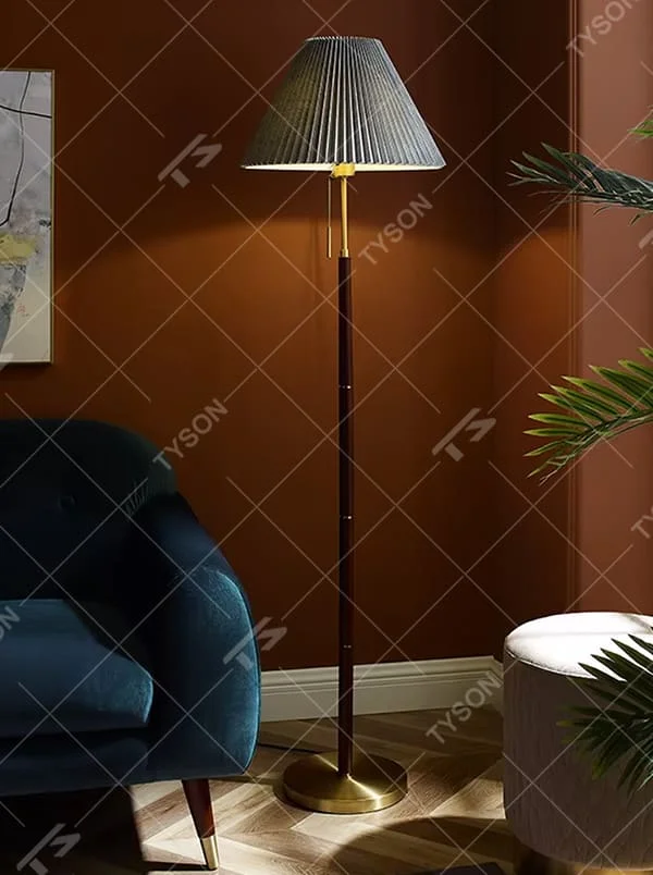 Light luxury vintage-style dark brown lamp pole gray pleated floor lamp, paired with golden decorations and base, soft and warm lighting, creating a high-end elegant space atmosphere.