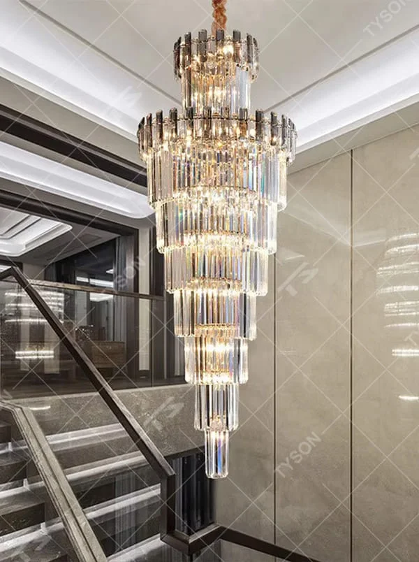 Luxurious multi-layer column crystal tower chandelier, golden frame paired with transparent long crystals, layered decreasing shape, brilliant and gorgeous lighting, creating a high-end luxurious atmosphere.