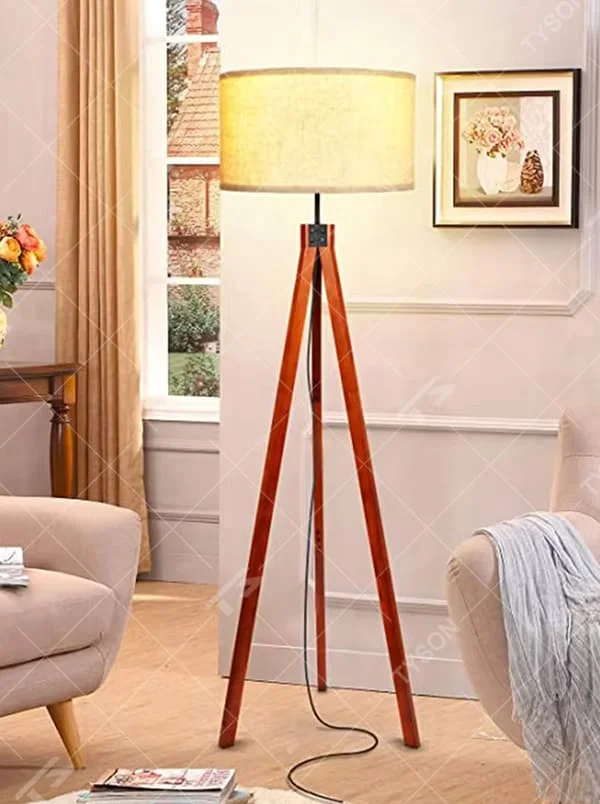 Vintage natural-style reddish-brown wooden tripod floor lamp, paired with beige fabric lampshade, soft and warm lighting, creating a natural and comfortable space atmosphere.