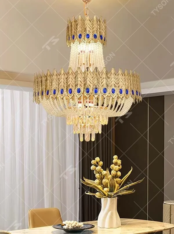 Light luxury double-layer golden leaf blue-decorated crystal chandelier, golden leaf shape + blue decorative blocks + crystal decorations, brilliant and gorgeous lighting, creating a high-end luxurious atmosphere.