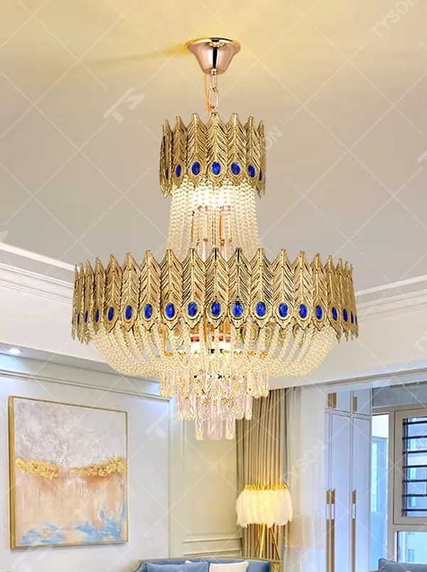This is a luxurious palace-style double-layer feather gem crystal chandelier, with a golden feather-shaped frame inlaid with blue gem decorations, paired with transparent crystal pendants. The double-layer design is magnificent and grand, with brilliant and elegant lighting, creating a noble and luxurious atmosphere.