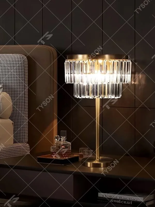 Light luxury golden metal crystal table lamp, multi-layer transparent crystal pendant lampshade + golden base, brilliant and soft lighting, creating a high-end elegant atmosphere.