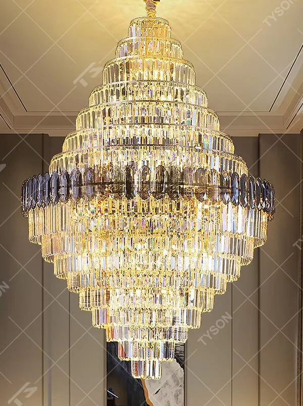 Luxurious multi-layer crystal tower chandelier, golden frame paired with transparent and dark crystal decorations, brilliant and gorgeous lighting, creating a high-end luxurious atmosphere.