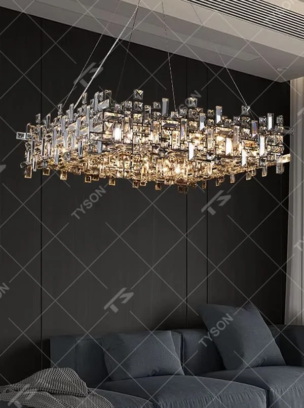 This is a modern luxurious rectangular crystal block combination chandelier, composed of a large number of transparent cut crystal blocks irregularly spliced into a rectangular shape, paired with a metal frame. The light through the crystals is brilliant and bright, creating a high-end modern luxurious atmosphere.