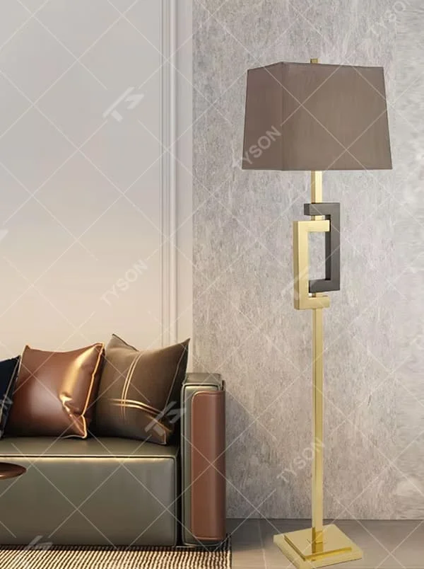 Light luxury black-gold geometric decorative floor lamp, golden metal lamp pole + dark brown square fabric lampshade, soft lighting, creating a high-end elegant atmosphere.