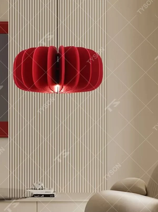 Modern artistic red pleated petal-shaped hanging chandelier, soft fabric material, soft and warm lighting, creating a stylish artistic atmosphere.