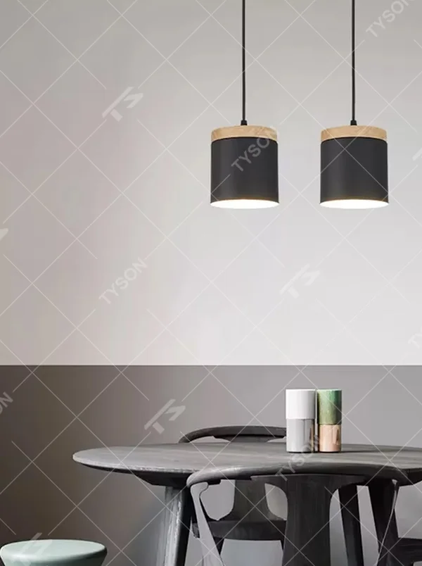 Minimalist black-wood cylindrical double-unit hanging lamp, black cylindrical lampshade + wooden top decoration + thin suspension rope, soft and uniform light, creating a simple natural home atmosphere.