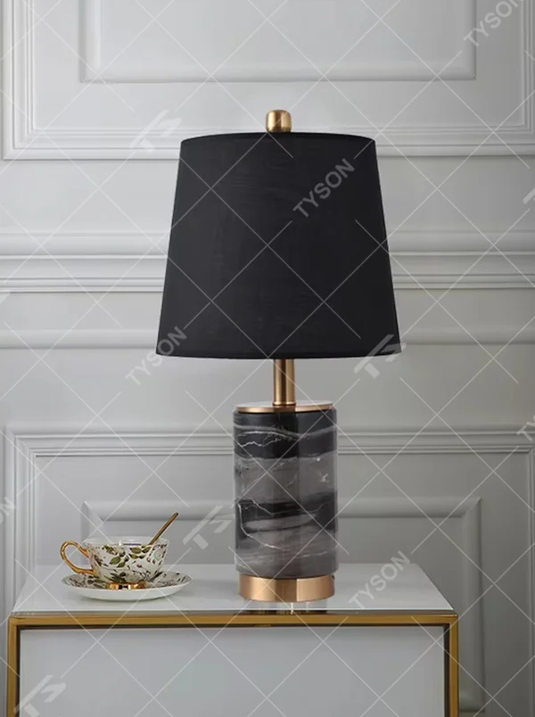 Light luxury white marble cylindrical table lamp, white marble base + golden metal decorations + beige fabric lampshade, soft warm light, creating an elegant light luxury home atmosphere.