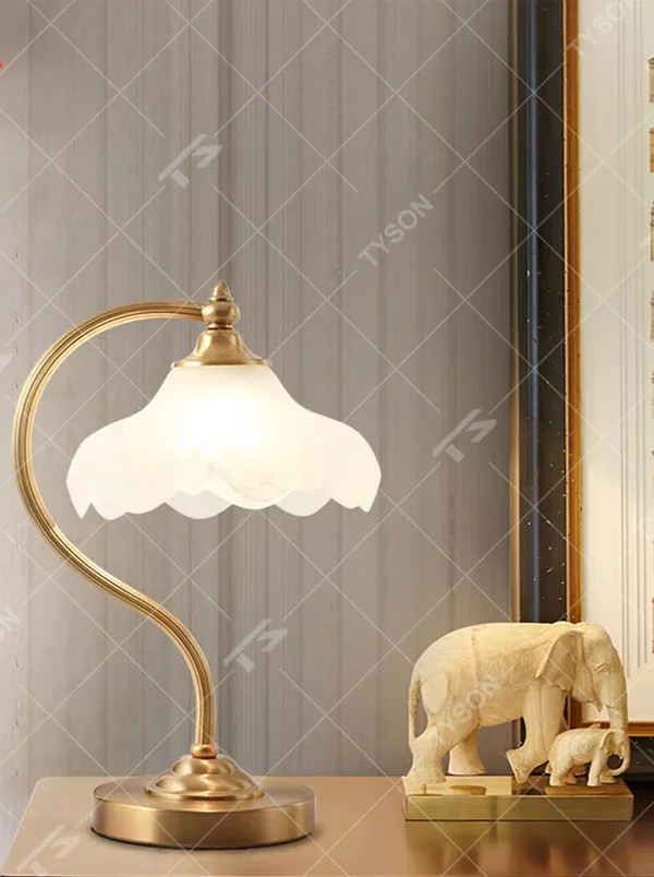 Vintage light luxury brass curved-arm petal lampshade table lamp, brass metal material + white petal translucent shade + warm light effect, creating an elegant and cozy home atmosphere.