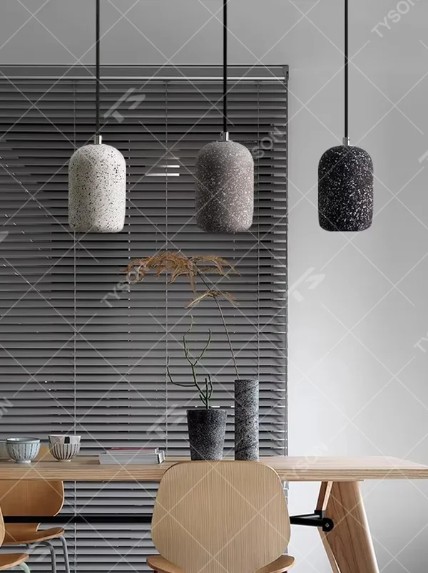 Industrial style speckled cement cylinder multi-head pendant light (multi-color), warm light effect, creating a minimalist industrial style atmosphere.