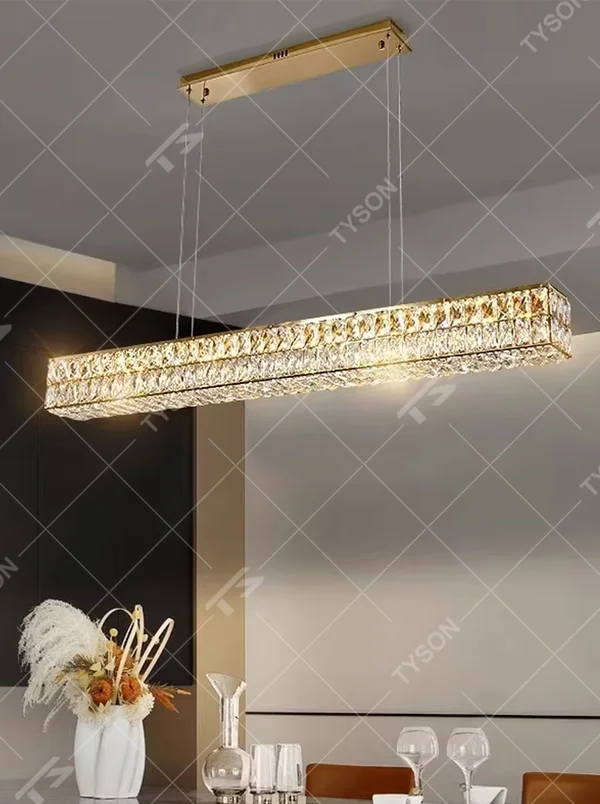 Light luxury modern long-shaped cut crystal chandelier, golden frame + full-set diamond-cut crystals + warm light effect, creating a luxurious dining atmosphere.