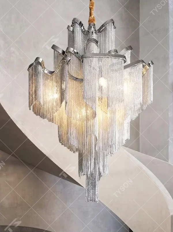 Modern light luxury silver frame crystal tassel irregular-shaped chandelier, warm light effect, creating a luxurious artistic atmosphere.