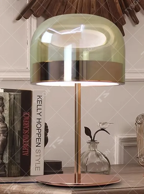 Modern light luxury amber glass dome copper base table lamp, warm light effect, creating an elegant retro space atmosphere.