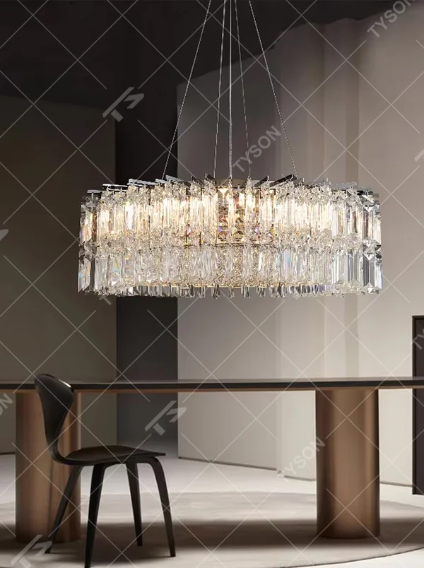 Luxury rectangular crystal chandelier (multi-faceted cut crystals + polished metal), warm light effect, creating a brilliant and high-end light luxury space atmosphere.