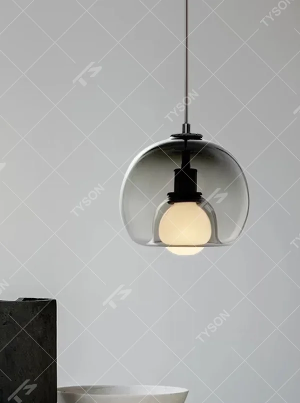 Modern minimalist dark green glass hemisphere chandelier, warm light effect, creating a high-quality minimalist space atmosphere.