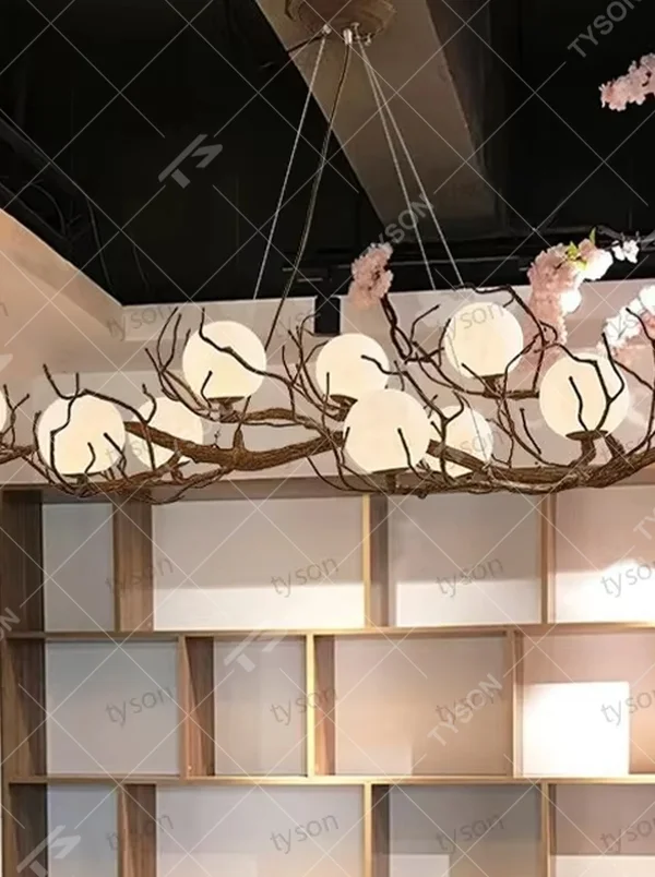 Natural dry branch glass ball chandelier (simulated dry branch frame + milk-white glass balls), warm light effect, creating a forest-style healing space atmosphere.