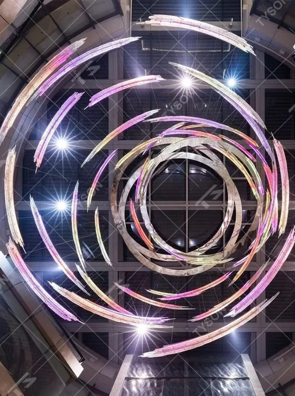 Art gradient spiral LED chandelier (color light stripes + ring structure), colorful warm light effect, creating a futuristic artistic atmosphere for high-end space decoration.