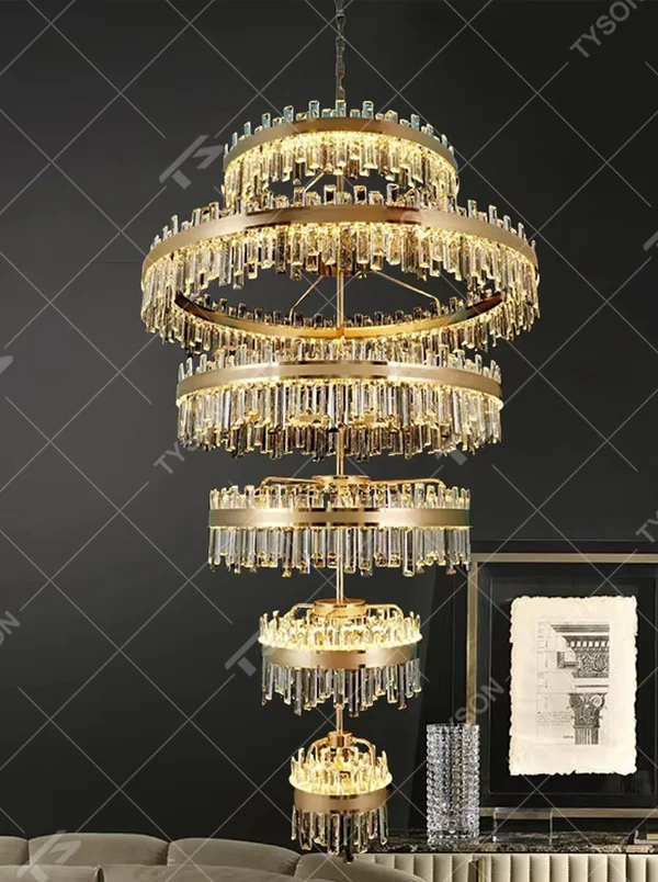 Modern luxurious multi-layer circular golden frame long crystal chandelier, warm light effect, creating a high-end artistic space atmosphere.