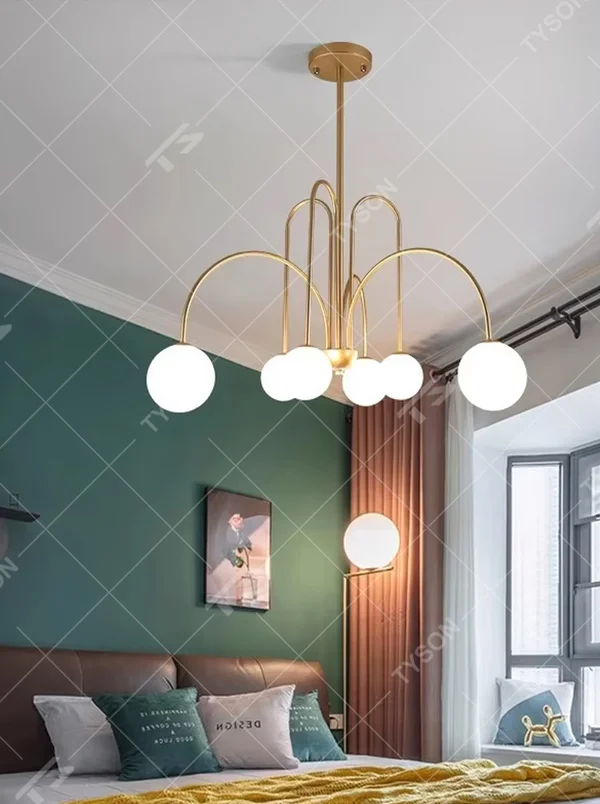 Light luxury gold arc glass ball chandelier (gold arc frame + milk-white glass balls), warm light effect, creating a soft and high-end home atmosphere.