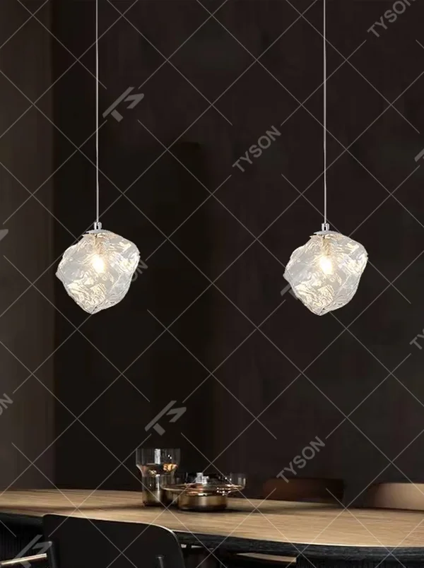 Art crystal stone glass chandelier (irregular crystal stone texture glass shade + metal hanging rod), warm light effect, creating a high-end artistic space atmosphere.