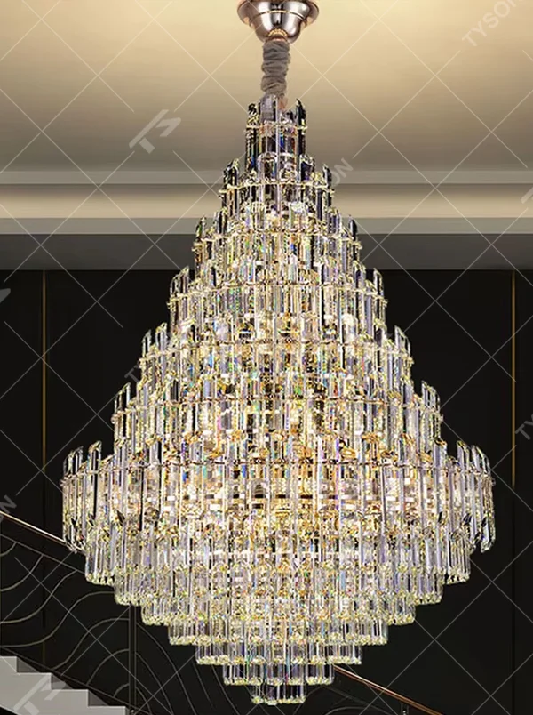European top-luxury pyramid-shaped golden frame long crystal chandelier, warm light effect, creating a luxurious and magnificent space atmosphere.