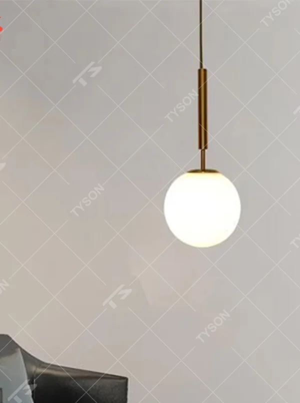 Minimalist gold rod glass ball chandelier (gold cylinder hanging rod + milk-white glass ball), warm light effect, creating a simple and high-end space atmosphere.