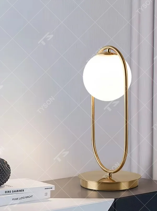 Minimalist gold ring glass ball table lamp (gold ring stand + milk white glass ball), warm light effect, creating a simple and high-end light luxury home atmosphere.