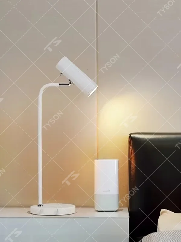 Minimalist white rod marble table lamp (white curved rod + adjustable lamp head + marble base), warm light effect, creating a simple and high-end home atmosphere.
