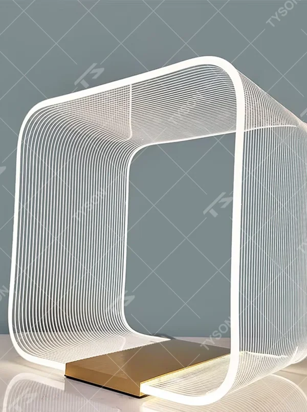 Avant-garde line frame table lamp (white line frame + gold base), warm light effect, creating a futuristic high-end space atmosphere.