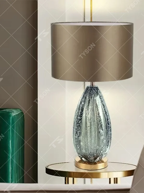 Light luxury black crystal fabric shade table lamp (black crystal texture base + coffee fabric shade), warm light effect, creating a calm and high-end home atmosphere.