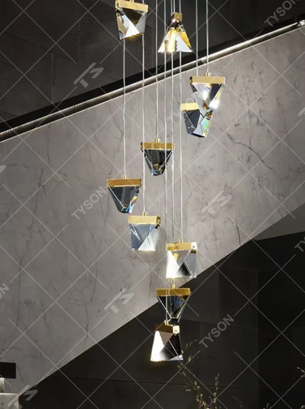 Modern geometric cut chandelier (gold-accessory triangular crystals + tiered hanging), warm light effect, creating a high-end artistic space atmosphere.