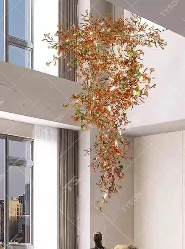 Art ginkgo leaf vine chandelier (simulated ginkgo leaves + built-in light source + drooping vine shape), warm light effect, creating a natural forest-style high-ceiling space atmosphere.