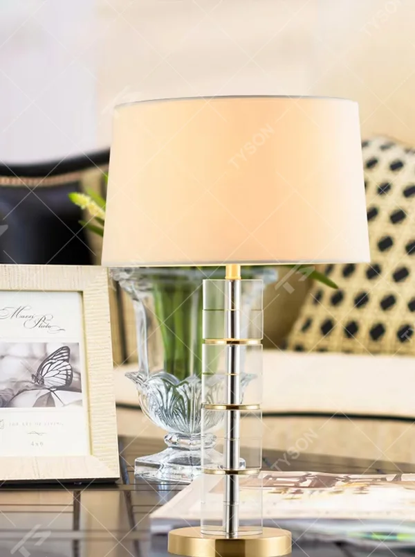 Light Luxury Stacked Acrylic Table Lamp (Off-white Fabric Umbrella Lampshade + Transparent Acrylic Stacked Lamp Post + Gold Metal Base), warm light effect, creating an exquisite and elegant home atmosphere.
