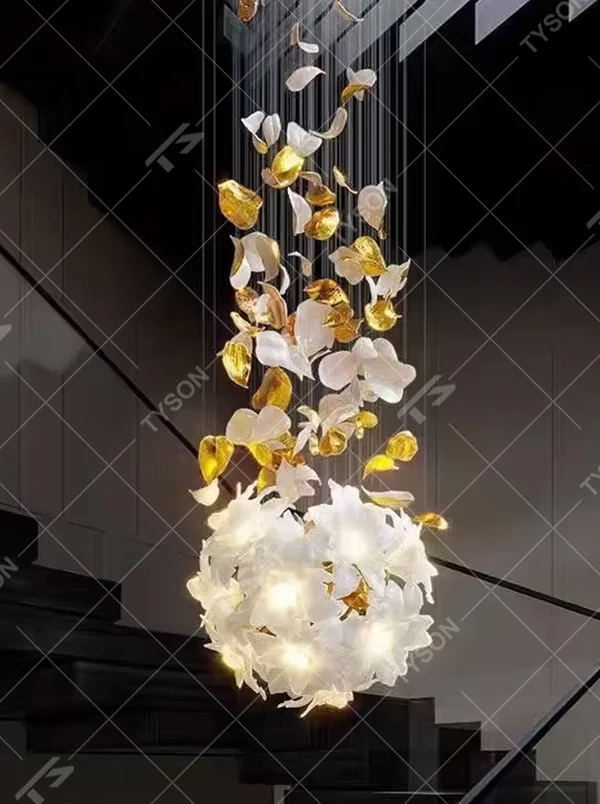 Art petal curve chandelier (white + gold gradient glass petals + metal hanging wires), warm light effect, creating a dreamy and luxurious high-ceiling space atmosphere.