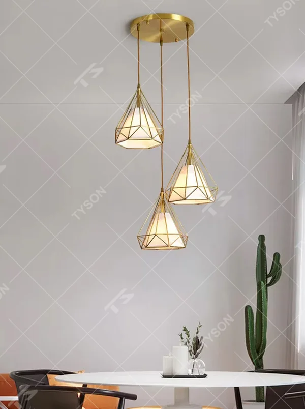 Light luxury geometric diamond triple chandelier (gold metal frame + translucent lampshade), warm light effect, creating a stylish and exquisite space atmosphere.