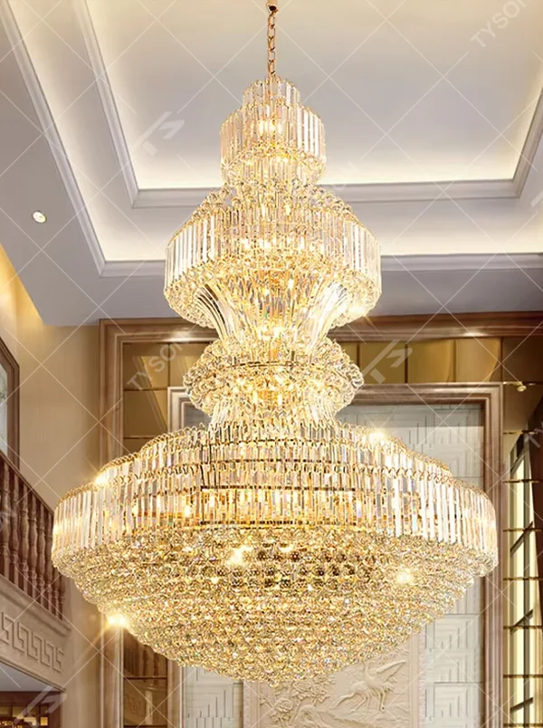 Multi-tiered golden crystal chandelier, with cascading crystal pendants and a gold metal frame, providing brilliant and luxurious light, designed to create a high-end and grand space atmosphere, suitable for engineering scenarios such as hotel lobbies, high-ceiling villa living rooms, and large banquet halls