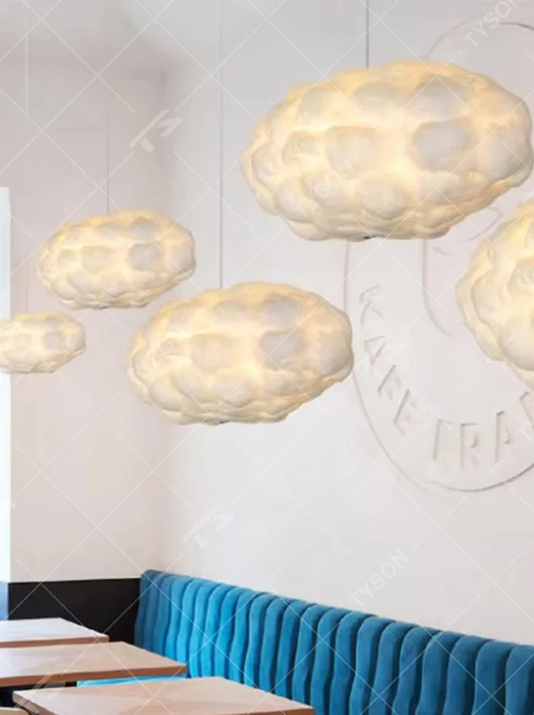 This dreamy cloud-shaped chandelier is made of fluffy fiber/fabric material, simulating the shape of real clouds, transmitting light softly and hung in varying sizes. It serves both lighting and decorative purposes, ideal for Internet celebrity restaurants, cafes, children's rooms, cultural and creative spaces and other scenarios.