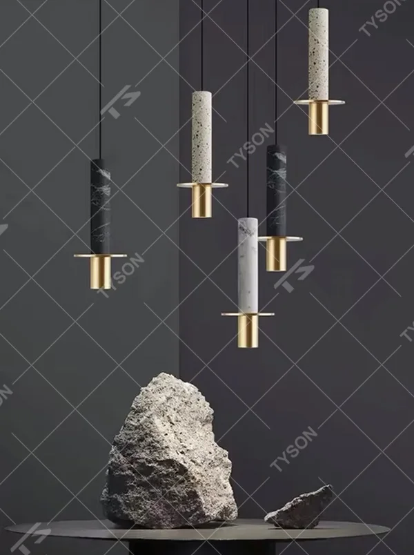 This modern light luxury raw stone chandelier features cylindrical lamp bodies made of natural stone (marble/travertine), paired with gold metal bases, hung in a scattered layout. It serves both lighting and decorative purposes, ideal for dining rooms, living rooms, high-end commercial spaces and other scenarios.